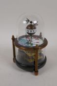 A small glass dome 'fish' desk clock, 6" high