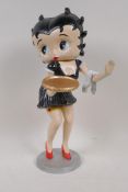A cast iron figure of a waitress in the style of Betty Boop, 12" high