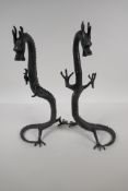 A pair of Chinese bronze dragons, 16½" high