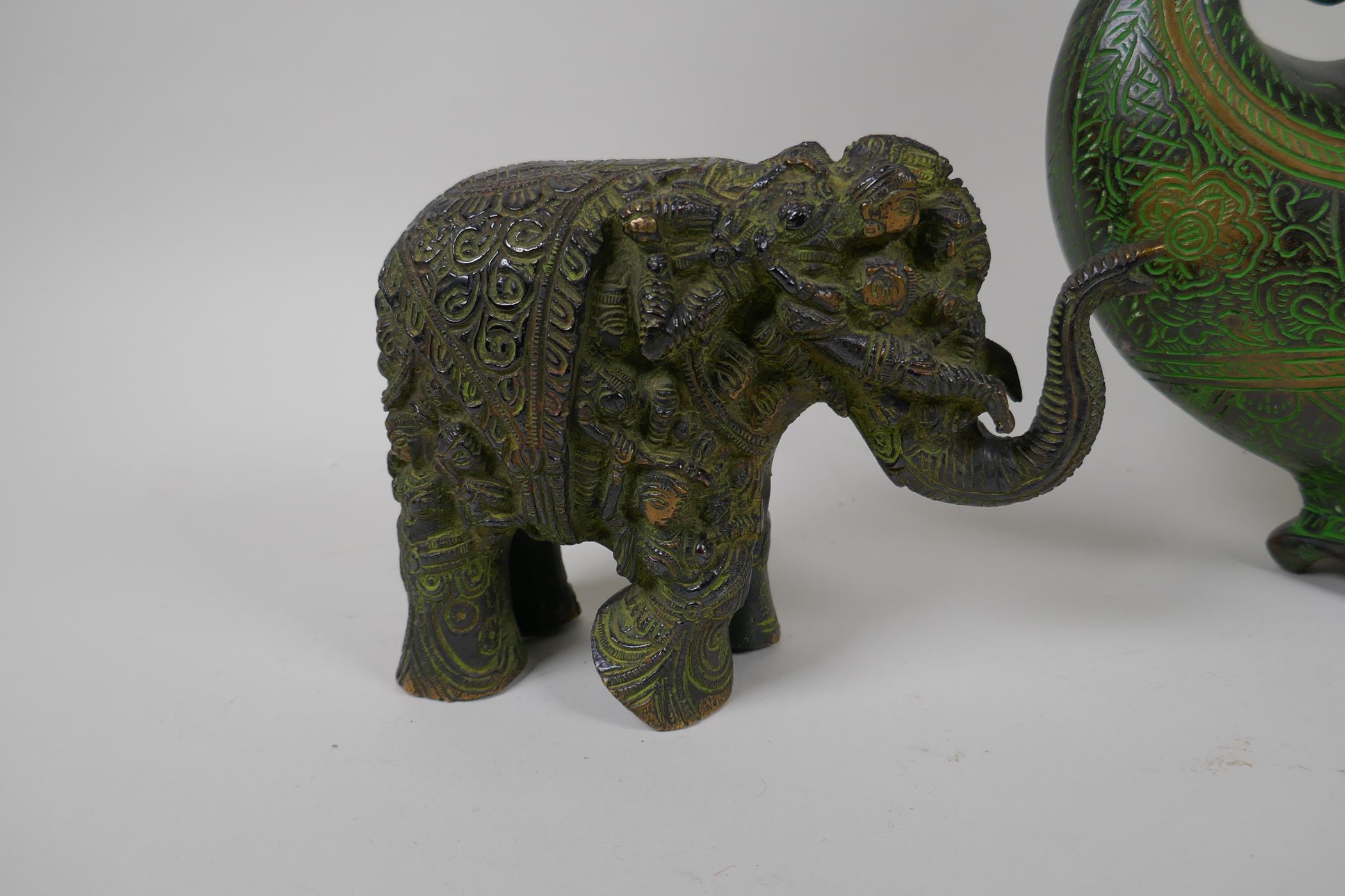 An Indian bronze figure of a sacred cow with applied white metal details, an Indian bronze - Image 2 of 5