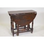 An c18th oak gateleg table with a single drawer, 40½" x 31" x 28" high, extended