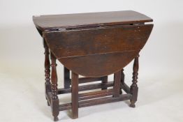 An c18th oak gateleg table with a single drawer, 40½" x 31" x 28" high, extended