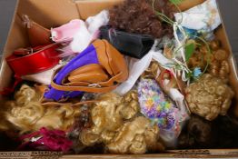 A quantity of dolls' wigs and accessories