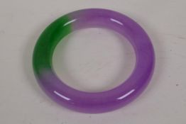 A Chinese lavender and green jade bangle, 3" diameter