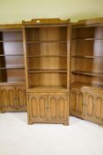 Three walnut bookcases, with open shelves above two cupboards, 30" x 12" x 73"