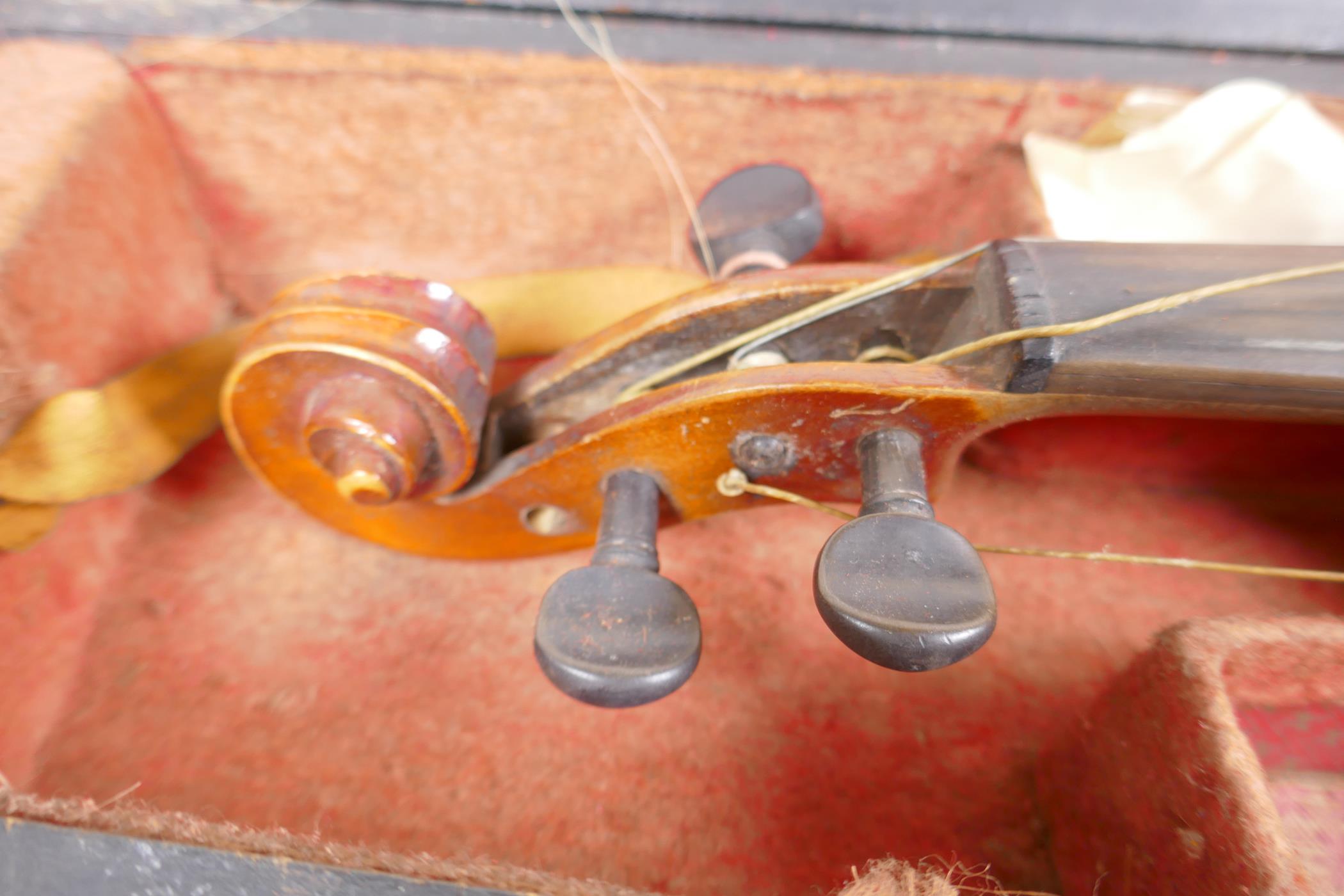 A vintage violin, 23½" long, with two bows, one marked Japan with chrysanthemum, in a fitted - Image 3 of 5