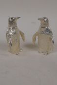 A pair of silver plated table salts formed as penguins, 3" high