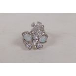 A silver floral dress ring set with opals and clear stones, size N/P