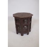An Indian carved and lacquered wood occasional table, 18" x 18"
