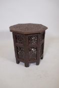 An Indian carved and lacquered wood occasional table, 18" x 18"