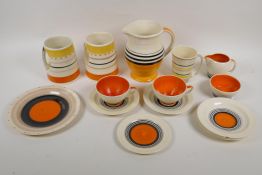 A quantity of Susie Cooper productions orange Tango pattern tea wares, including tea cups,
