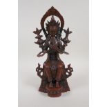 A Sino Tibetan coppered bronze figure of a seated Buddha, impressed double vajra mark to base, 12"