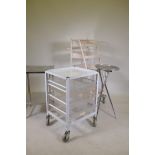 A stainless steel two tier medical instrument table, a fold up instrument table and two medical
