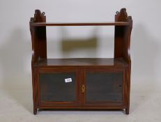 A Victorian mahogany hanging shelf with two glazed doors, 23" x 10" x 26"