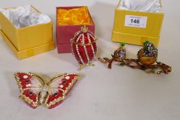 Three decorative metal trinket boxes in the form of a butterfly, two birds on a branch and an egg,