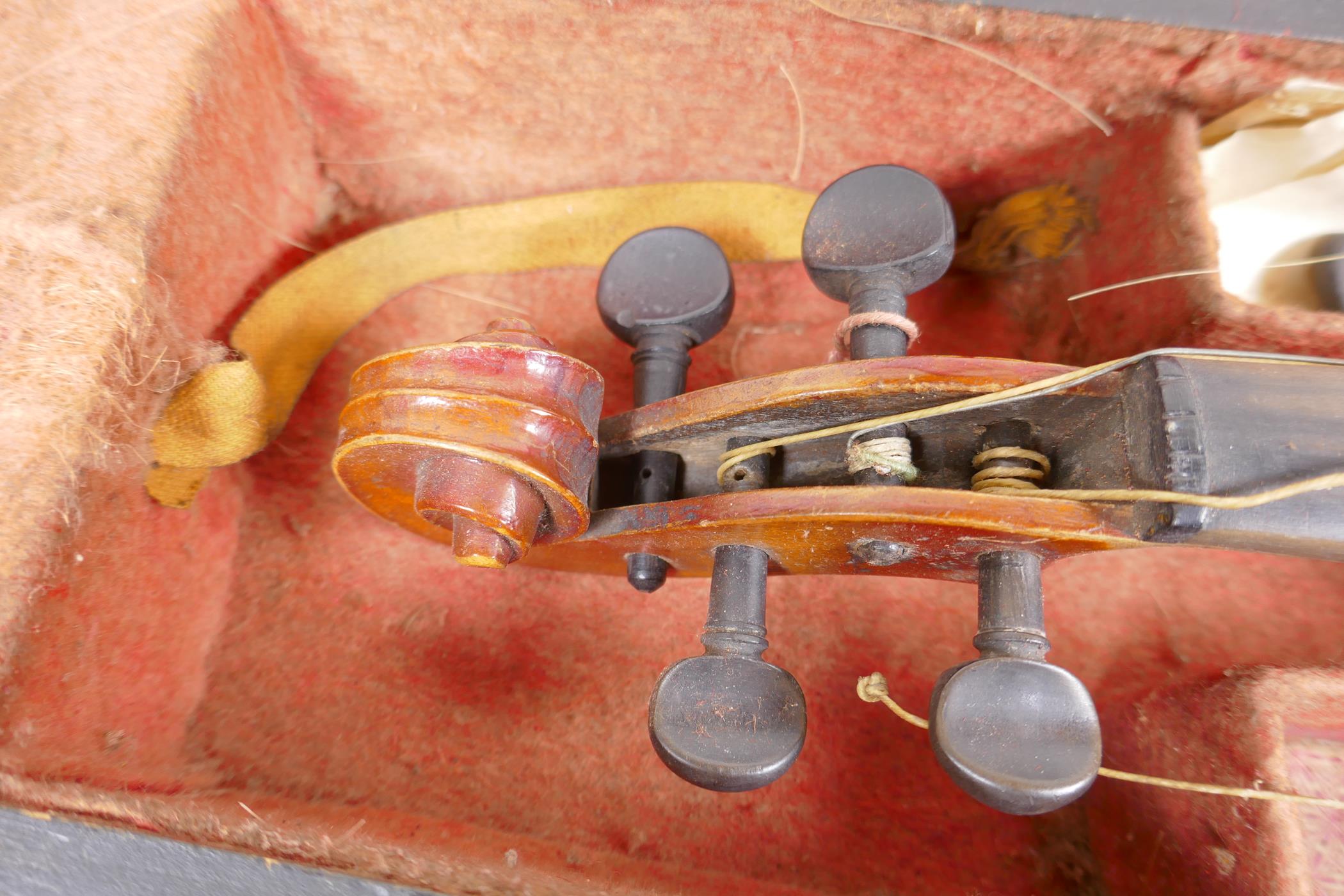 A vintage violin, 23½" long, with two bows, one marked Japan with chrysanthemum, in a fitted - Image 4 of 5