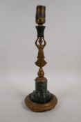 A table lamp in the form of a C19th French gilt bronze candlestick with marble base, converted to