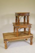 An Indian hardwood coffee table with iron fastenings and mounts, 43" x 24" x 16", and two similar