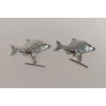 A pair of sterling silver fish cufflinks