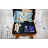 A suitcase of masonic regalia and memorabilia, including a 9ct gold tie pin, 1.2g