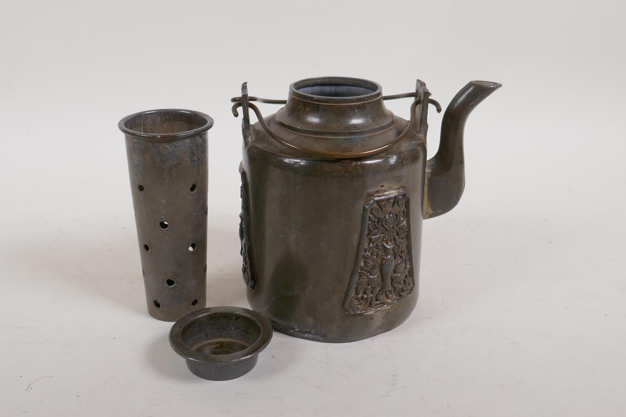 An antique Chinese pewter tea pot with applied decorative panels in relief and removable infuser/ - Image 4 of 6