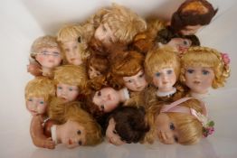 A quantity of mainly contemporary ceramic dolls heads etc