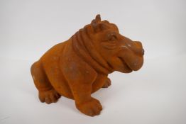 A cast iron garden figure of a hippopotamus, 11" high