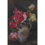 Kate Wylie, roses in a blue and white jug, signed, oil on canvas board, 13½" x 11½"