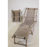 A slat back teak deck chair, and two stools