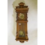 A late C19th walnut cased Vienna regulator wall clock with engraved brass dial, pendulum and