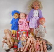 A collection of various dolls, largest 22"