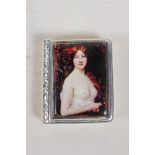 A 925 silver book set with a cold enamel plaque depicting a semi clad woman, 1½" x 1½"