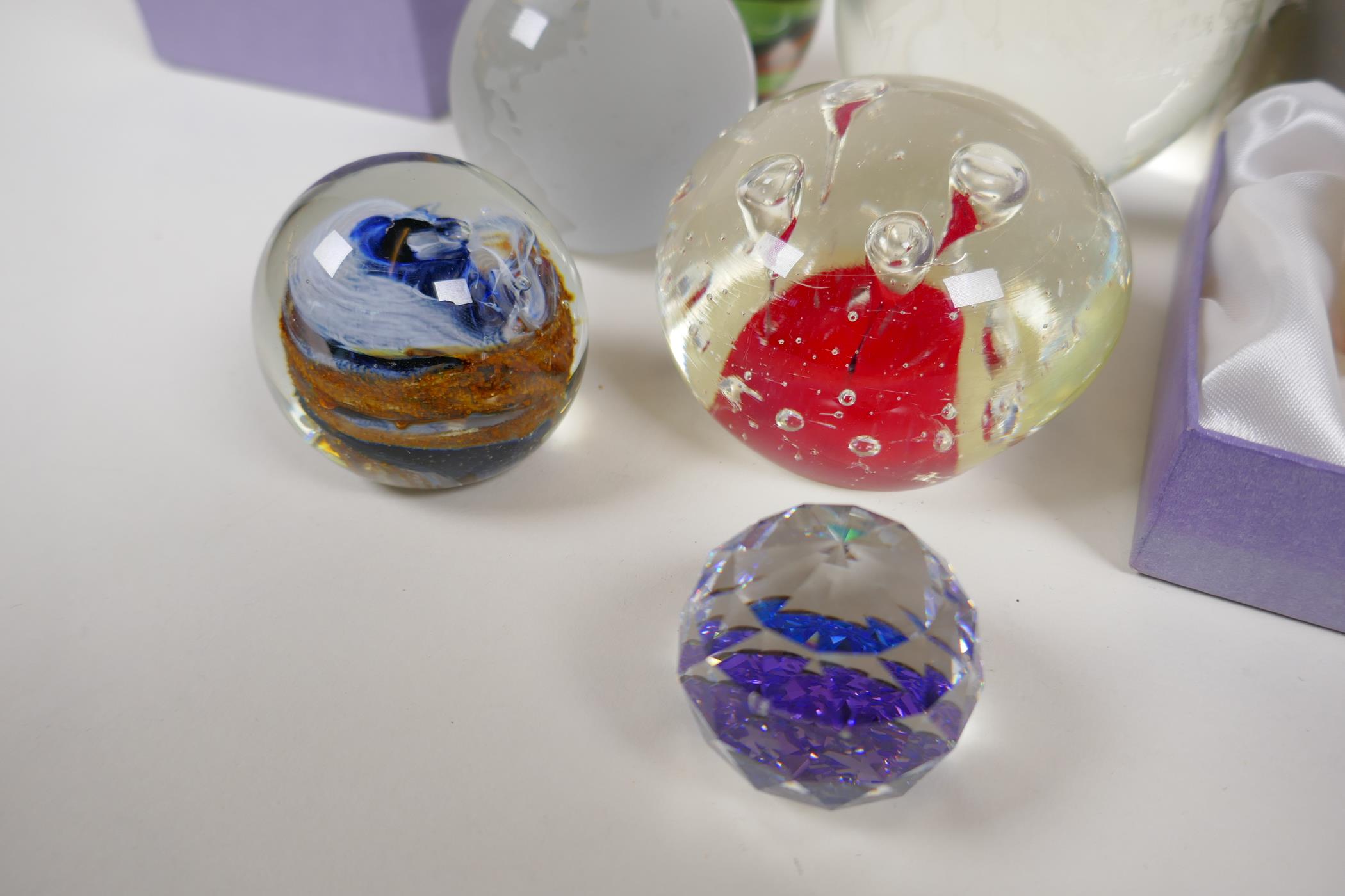 Four glass paperweights, two etched, glass world globes and two Swarovski faceted crystal weights - Image 2 of 4