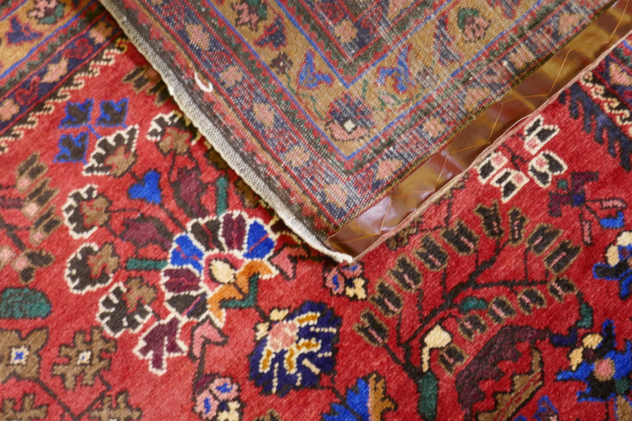 An oriental Hamadan wool carpet with medallion design on a red field, 82" x 54" - Image 3 of 3