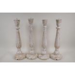 Two pairs of turned, painted and distressed pricket candlesticks, 17½"