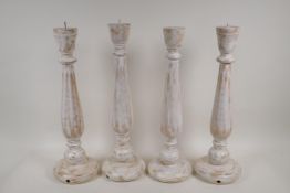 Two pairs of turned, painted and distressed pricket candlesticks, 17½"