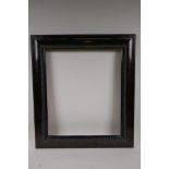 An early C20th Dutch style picture frame, with simulated tortoiseshell and ripple decoration, 18"