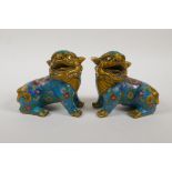 A pair of Chinese cloisonne enamelled metal temple lions, 4½" high