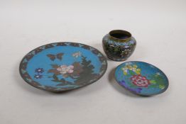 A Chinese cloisonne enamel pot with lotus flower decoration, a cloisonne saucer with butterfly