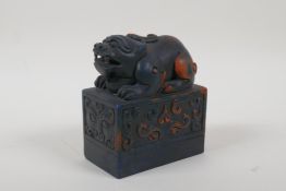 A Chinese reconstituted hardstone seal with a kylin knop, 4" high