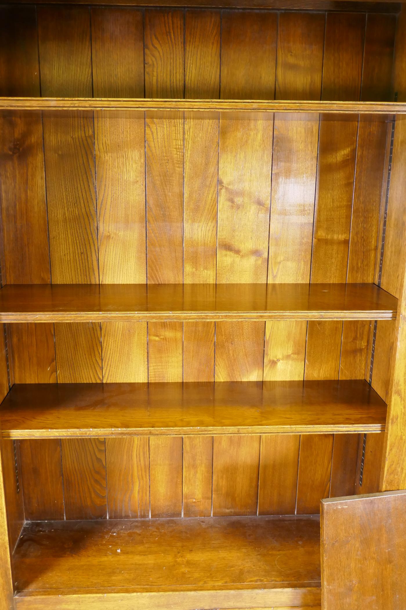 An oak open bookcase over two cupboard doors, 41½" x 13½", 80½" high - Image 2 of 2