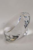 A large diamond shaped clear glass paperweight, 6" diameter