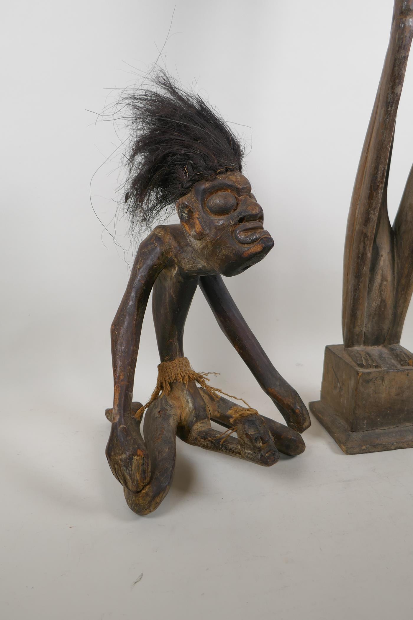 An African carved hardwood and hair tribal fertility figure, and another carving of a slender - Image 2 of 5