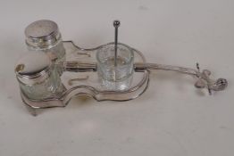 A silver plate and glass cruet, the base formed as a violin, 9" long