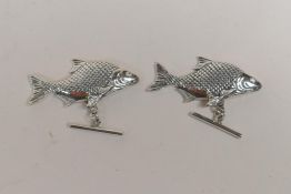 A pair of sterling silver fish cufflinks