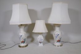 A pair of Chinese ceramic table lamps with chrome bases and a small lamp, 34" with shades