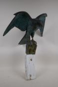 A bronzed composition model of a kestrel with verdigris patination, 14½" high excluding mount