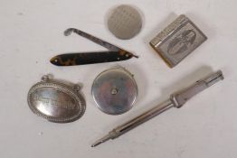 A quantity of silver plated curios including pen, Irish Whiskey label, tape measure etc
