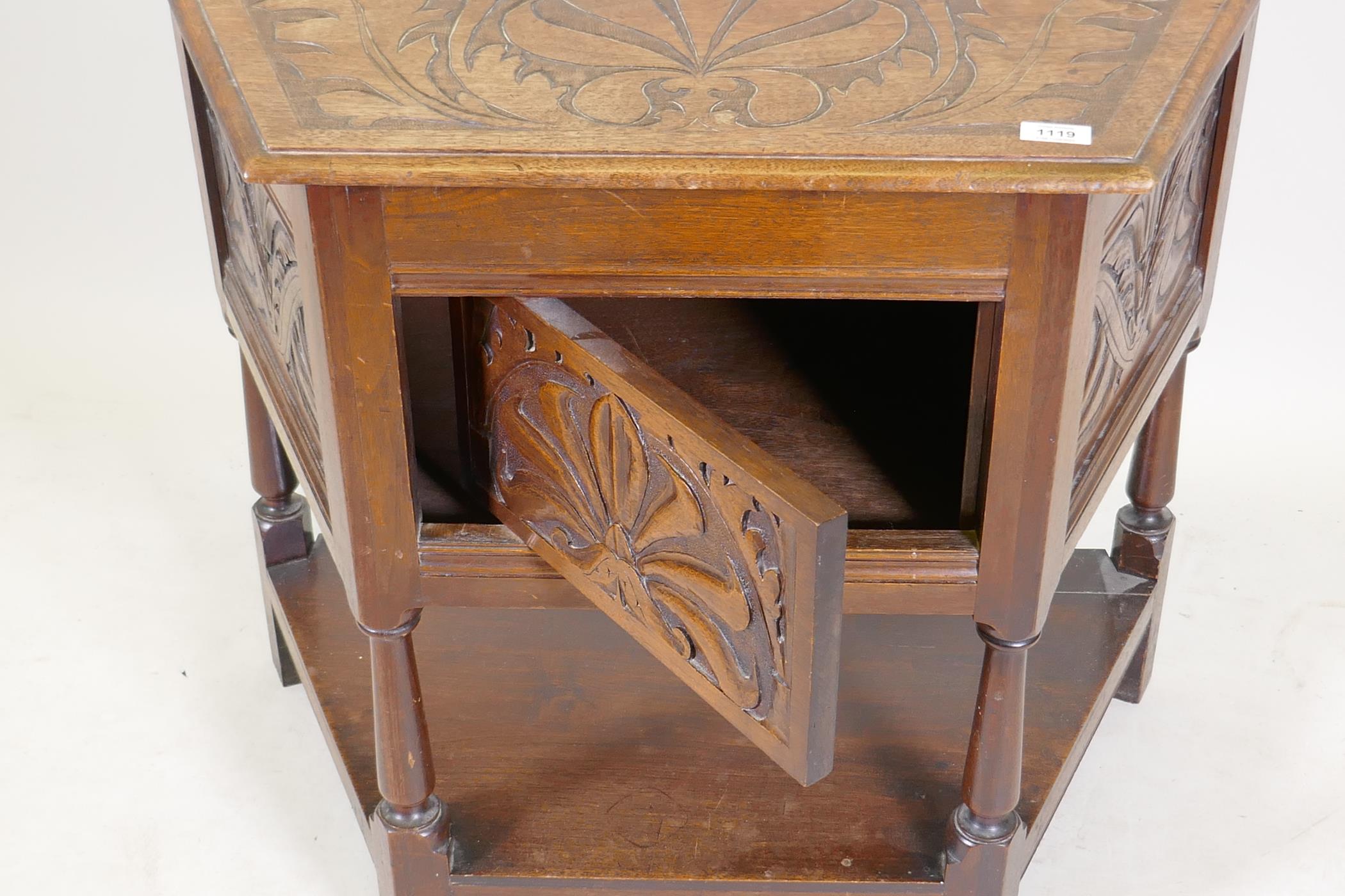 An early C20th walnut credence cabinet with carved panels and turned supports united by an - Image 3 of 3