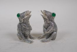 A pair of silver plated condiments in the form of frogs, 2" high